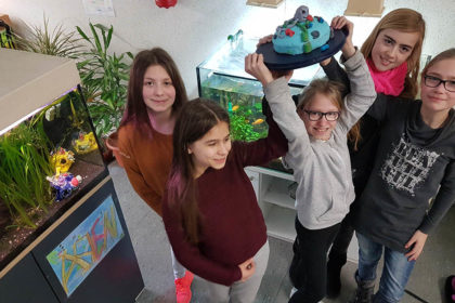 aquarien-ag-mit-kuchen-beitragsbild